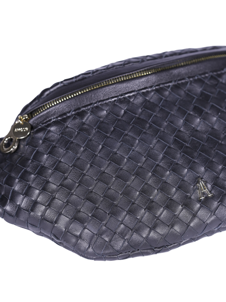 CRAIE STUDIO - SAC CEINTURE EN CUIR TRESSÉ NOIR